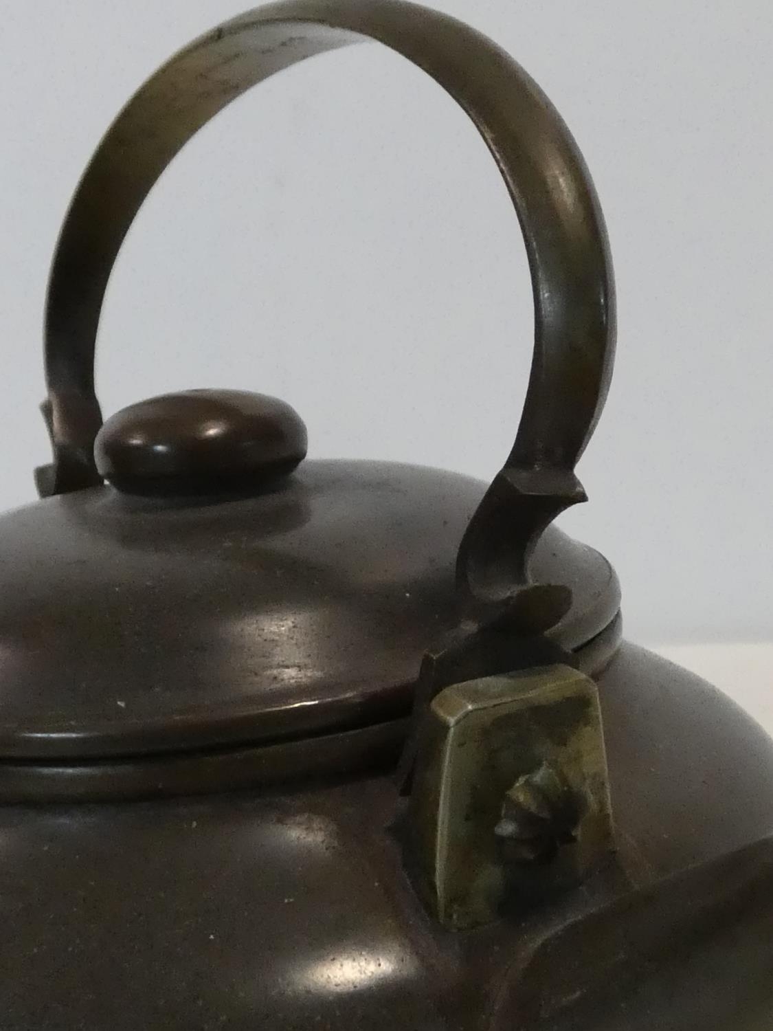 Two Chinese Yixing Pottery teapots with cast brass handles and finials and banding around the edges, - Image 9 of 11