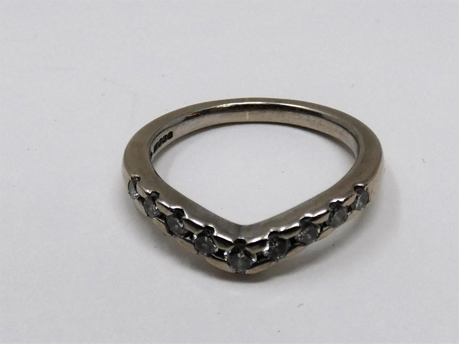 A vintage wishbone 18ct white gold and diamond half eternity ring. Set with nine round brilliant cut - Image 4 of 5