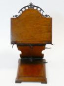 A late 19th century oak table lectern with fully articulated ratcheted folding action with arched