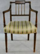 A late Georgian mahogany open armchair with stuffover seat raised on turned tapering supports. H.