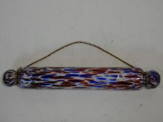 A Victorian Nailsea red and blue blown glass rolling pin. W.42cm