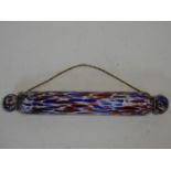 A Victorian Nailsea red and blue blown glass rolling pin. W.42cm