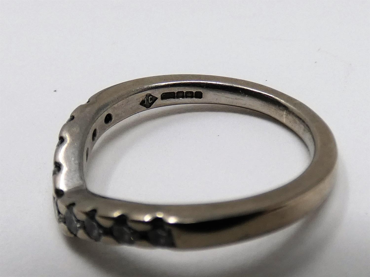 A vintage wishbone 18ct white gold and diamond half eternity ring. Set with nine round brilliant cut - Image 2 of 5