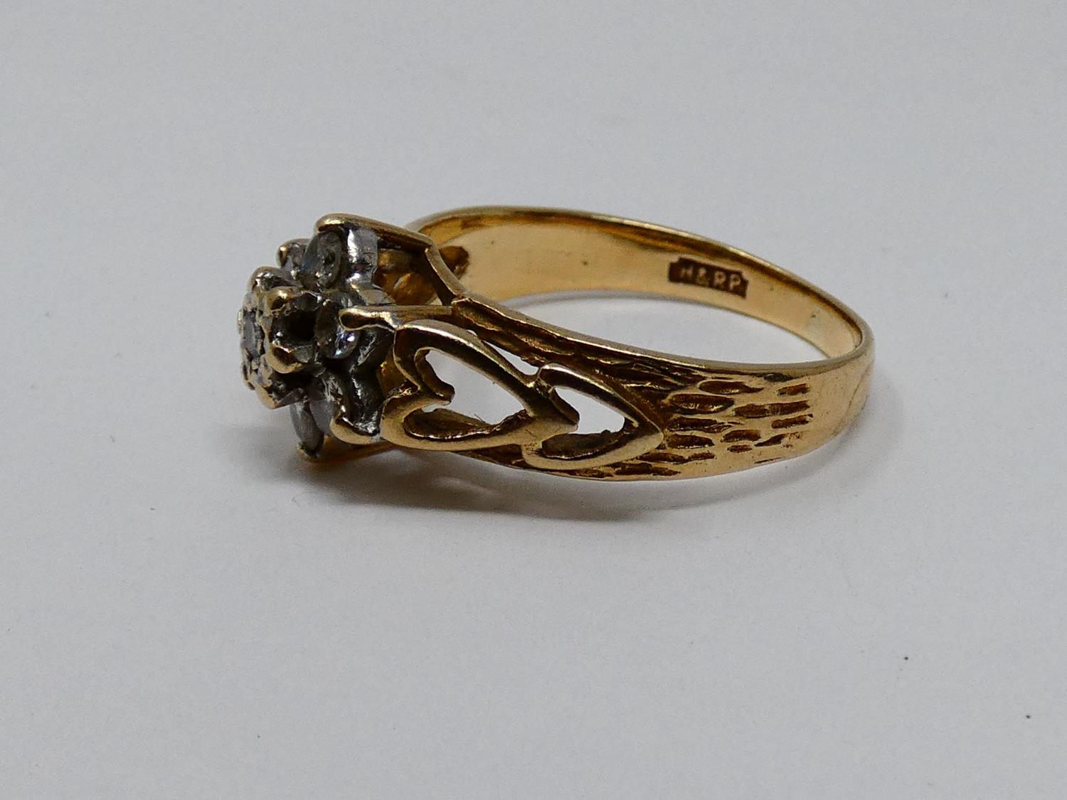 A vintage diamond and 9ct yellow gold floral cluster ring, set with seven round brilliant cut - Image 5 of 5