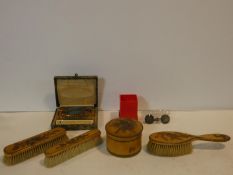 A papier mache and decoupage dressing set with birds and flowers, two French commemorative medals