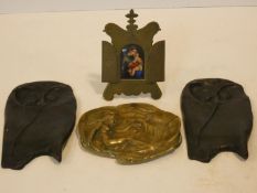 A 19th century brass framed oil on ceramic panel of the Madonna and Child and two bronze stylised