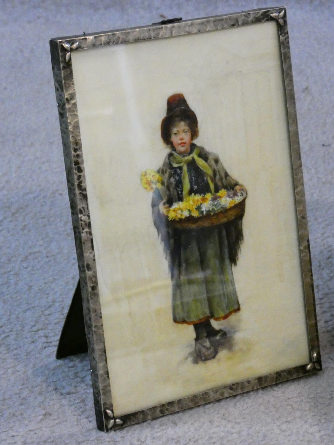 A gouache on parchment in antique beaten metal easel frame, Dutch daffodil seller. in21x15cm