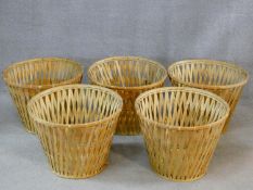 A set of five large wicker baskets. H.40 W.53 D.53cm