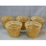 A set of five large wicker baskets. H.40 W.53 D.53cm