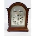 An early 20th century mahogany cased Westminster chime bracket clock with silvered dial flanked by