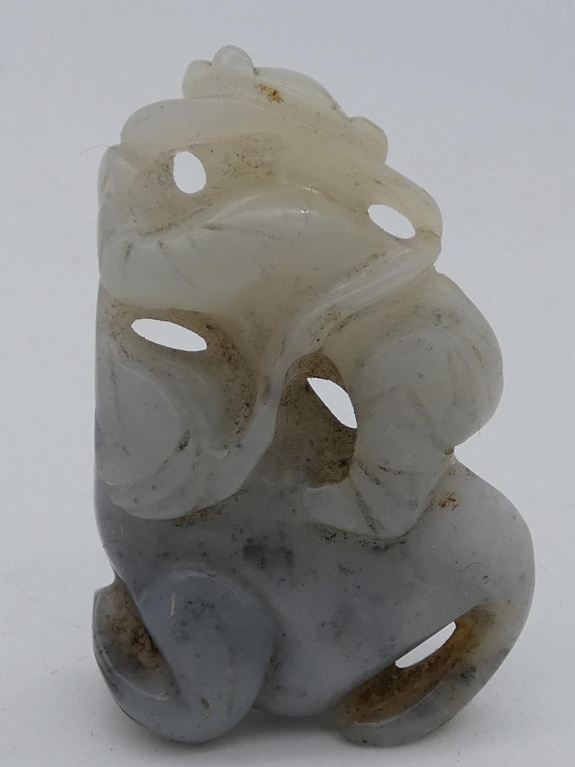 A miscellaneous collection of seven Chinese carvings in jade and coral, including figures, - Image 3 of 15