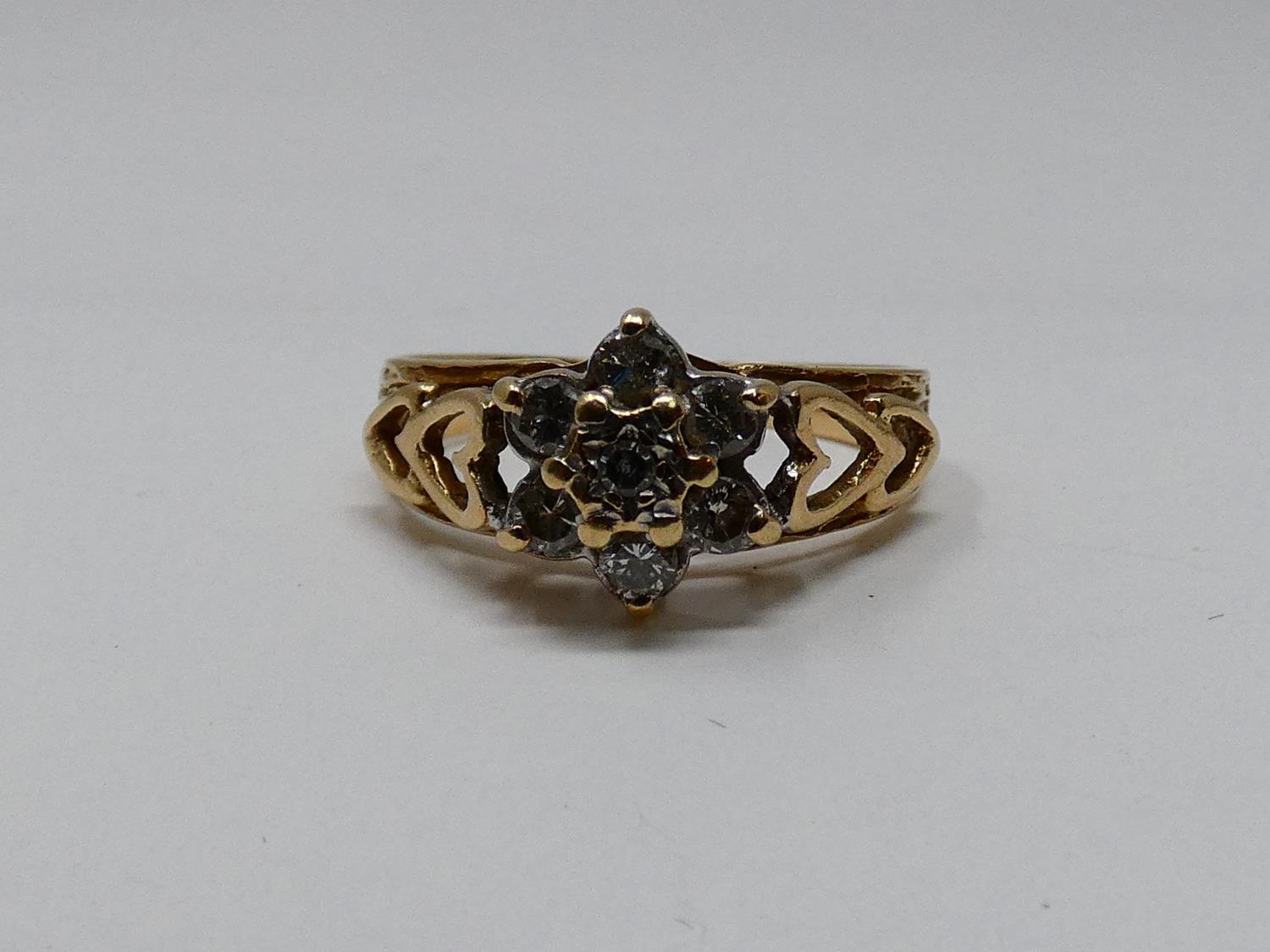 A vintage diamond and 9ct yellow gold floral cluster ring, set with seven round brilliant cut - Image 2 of 5