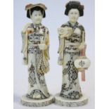 Two C.1900 Japanese carved bone geisha figures, engraved and painted, one carrying a lantern. H.20cm