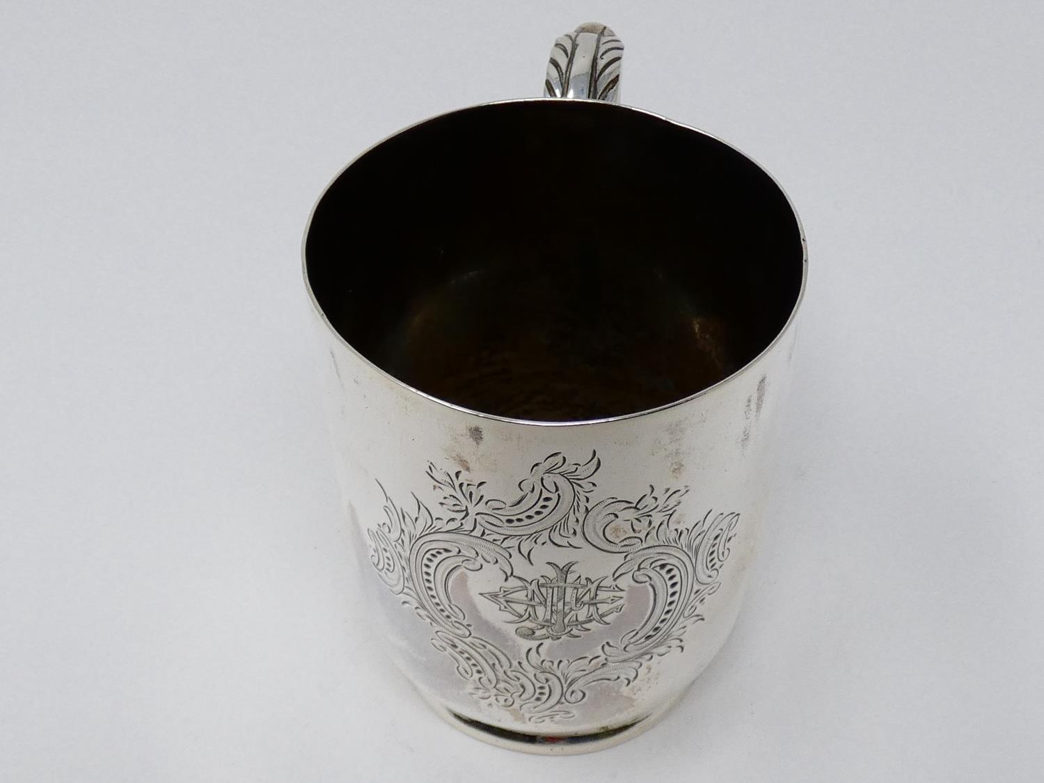 A Victorian Walker & Hall silver tankard with engraved monogram within stylized scrolling foliate - Image 3 of 7