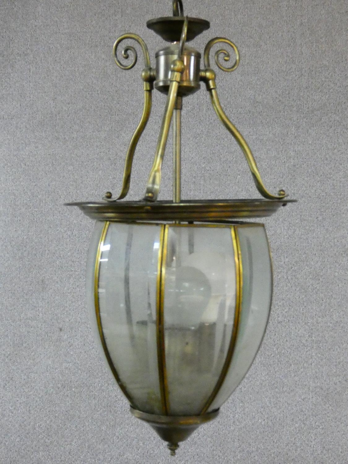 A metal framed ceiling light pendant shade with facetted glazed panel sides. H.50 W.27 D.27cm