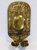 A 19th century brass repousse design wall sconce with two candelabras with stylised palmette and