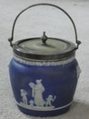 An antique cobalt jasper ware Wedgwood biscuit barrel with silver plated handle and lid. It has faux