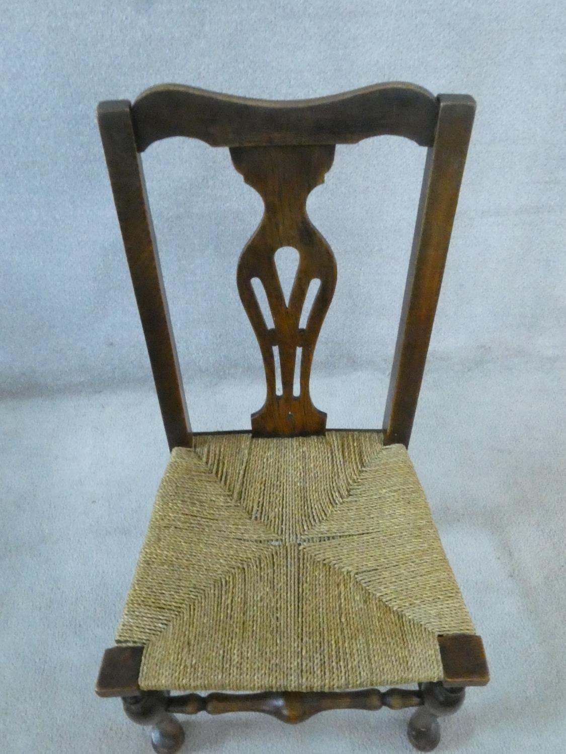 A set of six 19th century country oak dining chairs with pierced splat backs above woven rush - Image 3 of 4