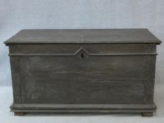 An 18th century oak coffer with hinged top on block feet. H.73 W.139 D.65cm