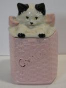 A vintage ceramic painted McCoy pottery, USA kitten in a basket lidded cookie jar. Makers stamp to