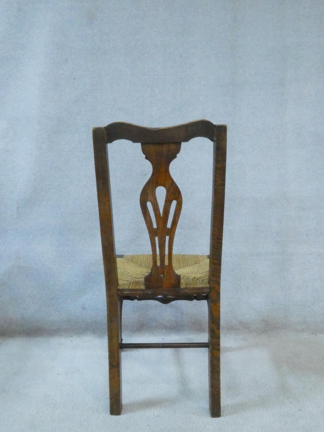 A set of six 19th century country oak dining chairs with pierced splat backs above woven rush - Image 4 of 4