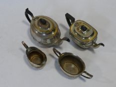 A C.1900 silver plated three piece tea set along with a similar tea pot. H.16xW.29xL.13cm