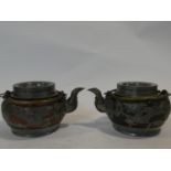 Two Chinese vintage Yixing pottery tea pots with pewter dragon pierced overlays. One with black