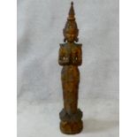 A large Oriental carved wooden, painted, gilded and mirror tiled embellished Buddha figure. H.97cm