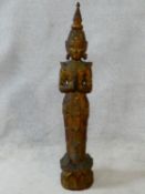 A large Oriental carved wooden, painted, gilded and mirror tiled embellished Buddha figure. H.97cm