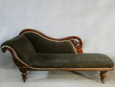 A Victorian carved mahogany frame chaise longue in velour upholstery on bulbous turned supports