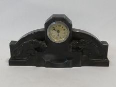 A German Art Deco spelter mantel clock, the central face flanked by crouching panthers on stepped