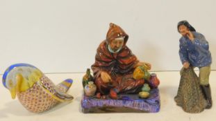 A Continental porcelain figure of a duck in polychrome glaze and two Royal Doulton figures; The