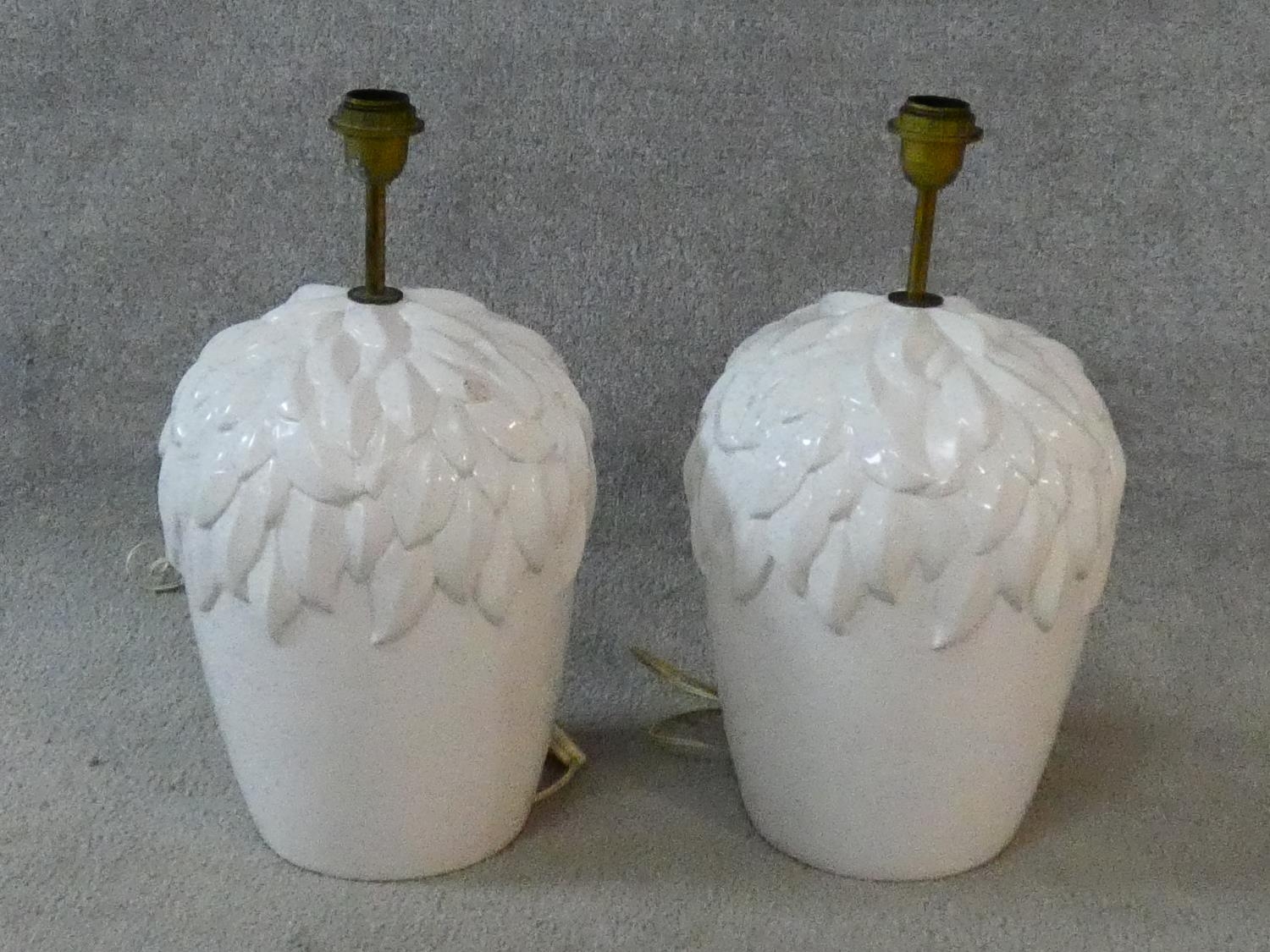 A pair of glazed table lamps of bulbous form with leaf decoration. H.50xD.26cm