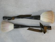 Two large Chinese carved horn calligraphy brushes with horse hair tips. L.50cm