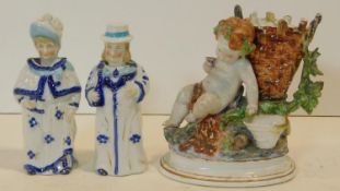 A Victorian male and female hand painted ceramic bobble head figure along with an antique hand