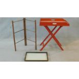 A red painted 19th century butler's tray on a folding stand, a lacquered twin handled tray and a