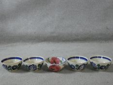 A set of five Spanish ceramic bowls with hand painted floral design. Makers stamp to the base.