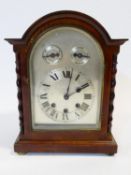 An early 20th century mahogany cased Westminster chime bracket clock with silvered dial flanked by