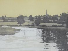 A framed and glazed limited edition print (51/151), riverscape with village in distance,