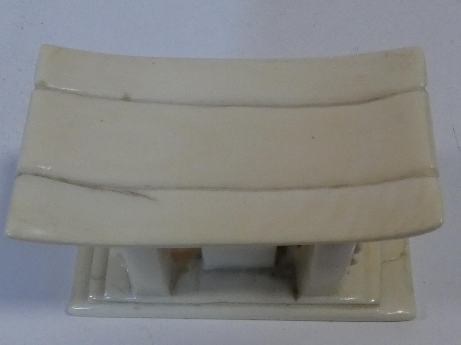 An early 20th century carved ivory African miniature headrest/ashanti stool. H.7xW.10xL.5cm - Image 3 of 4