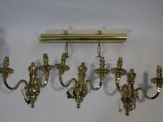 A set of three heavy solid brass Dutch style wall candelabras and a brass wall picture light. H.31cm