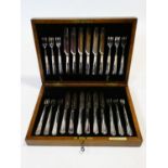 A C.1900 set of twelve Elkington plate dessert knives and forks in brass inlaid fitted oak box. H.