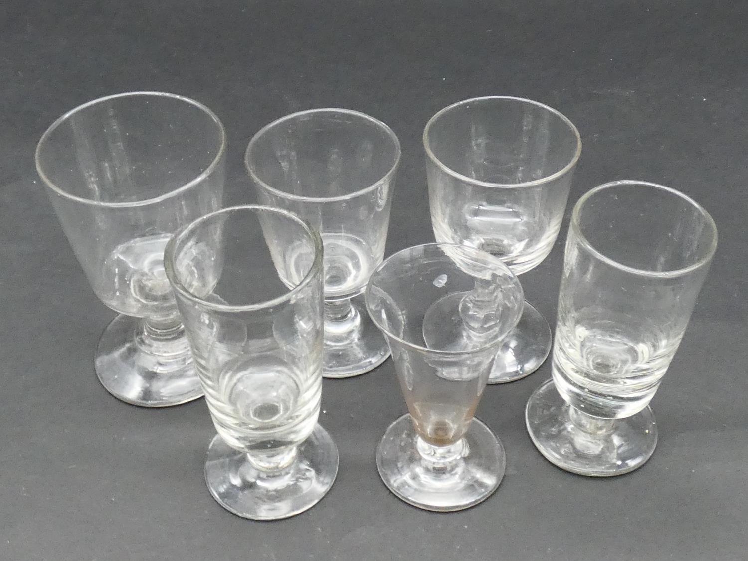 A collection of six 19th and 18th century glasses. Including two 19th century absinthe glasses, a