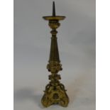 A 19th century ecclesiastical gilt metal pricket candle stand, set with glass cabochon stones. H.