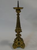 A 19th century ecclesiastical gilt metal pricket candle stand, set with glass cabochon stones. H.