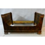 A 19th century French mahogany bateau lit, to take a single mattress. H.112 L.202 W.123cm