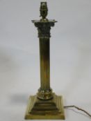 A vintage brass Corinthian column table lamp on stepped base. H.46cm