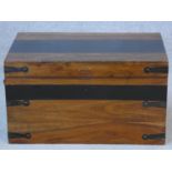 An Eastern teak and metal bound travelling casket with twin iron carrying handles. H.28xW.50xL.33cm