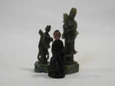 Three Chinese carved spinach jade Guanyin figures. H.24cm