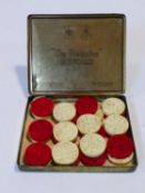 A set of twenty four (twelve of each) Chinese carved ivory draughts pieces, one set dyed red. H.